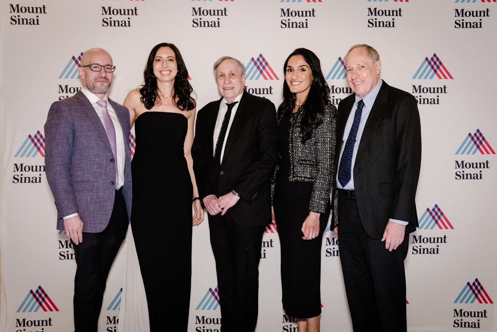 five doctors standing together