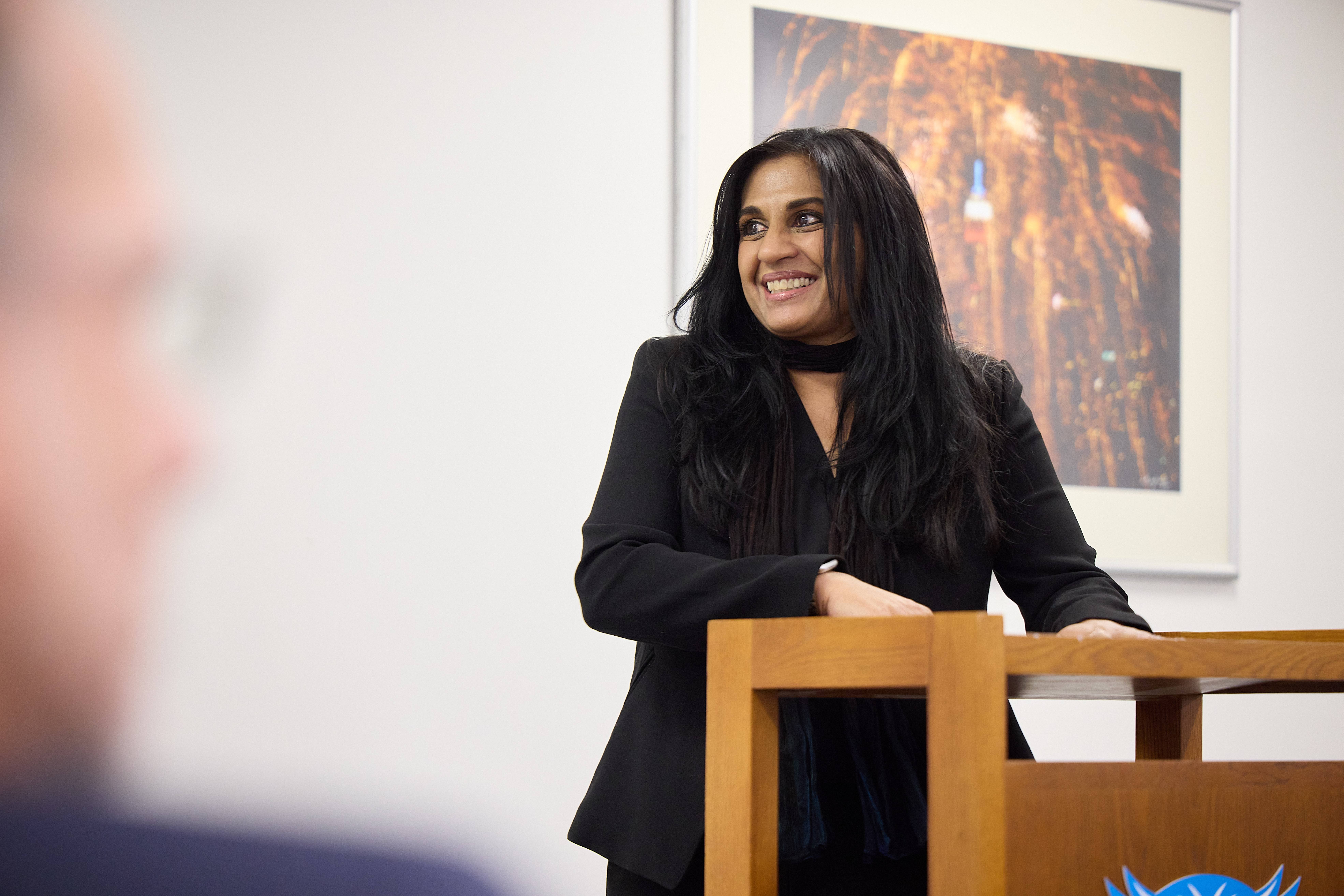 Dr. Taufique smiling presenting at ribbon cutting