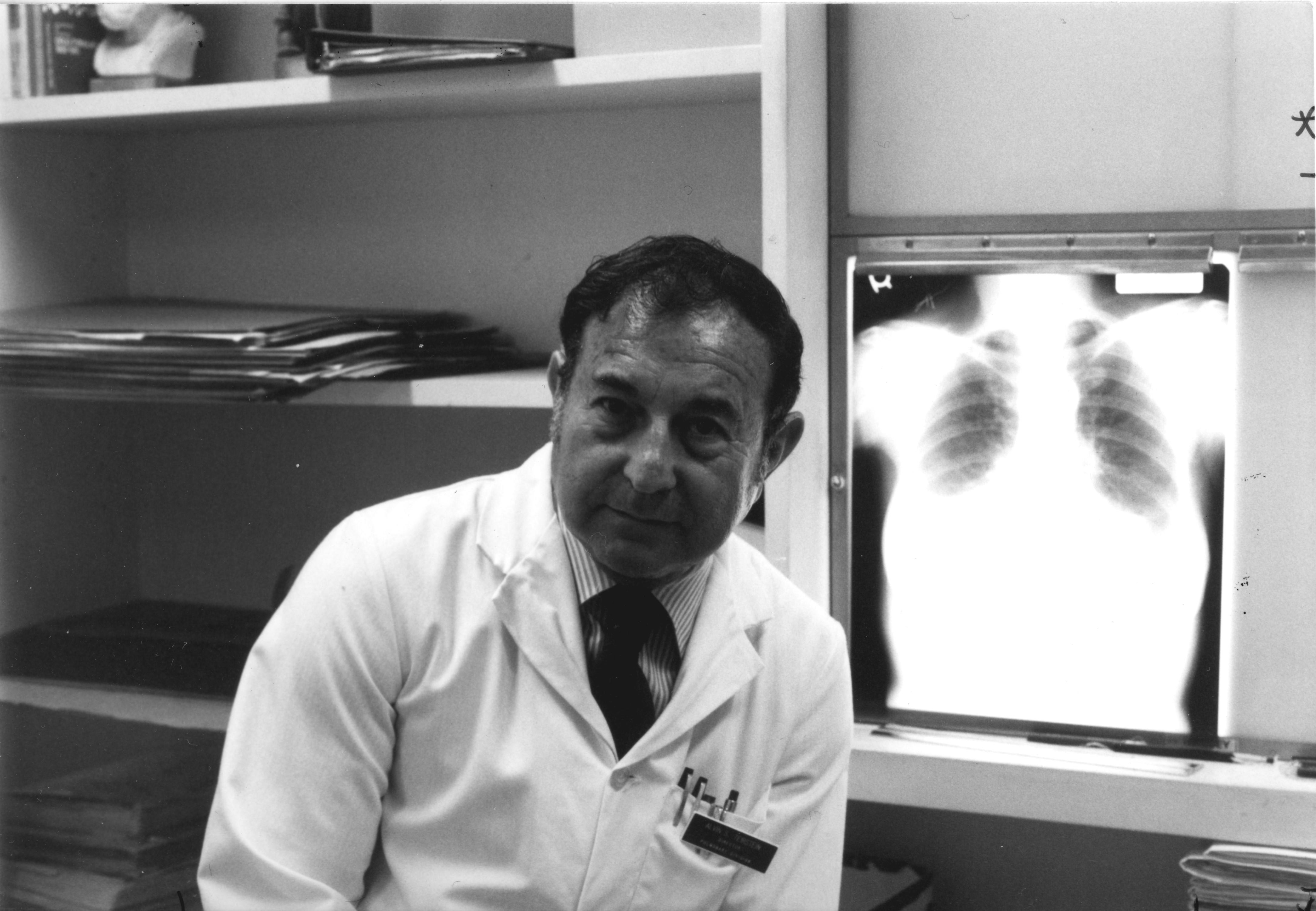 Dr. Alvin Teirstein in his office with a chest x-ray circa 1980