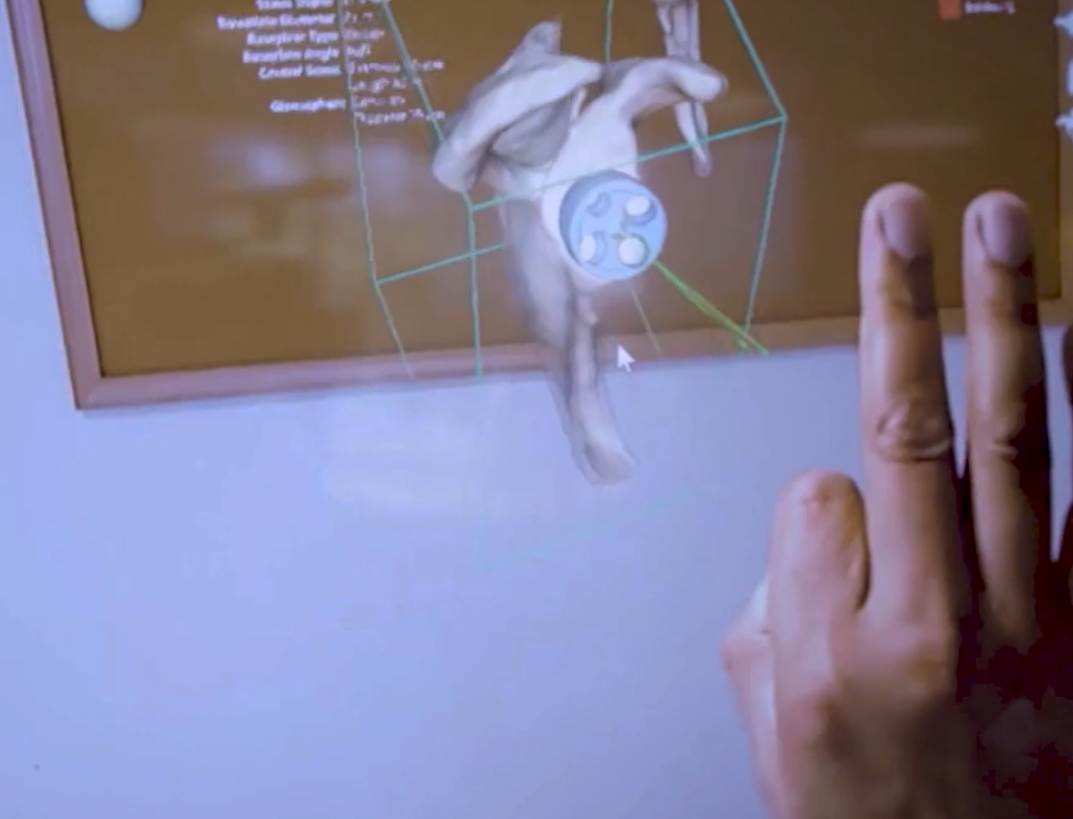 a demonstration of AI with a hand and screen
