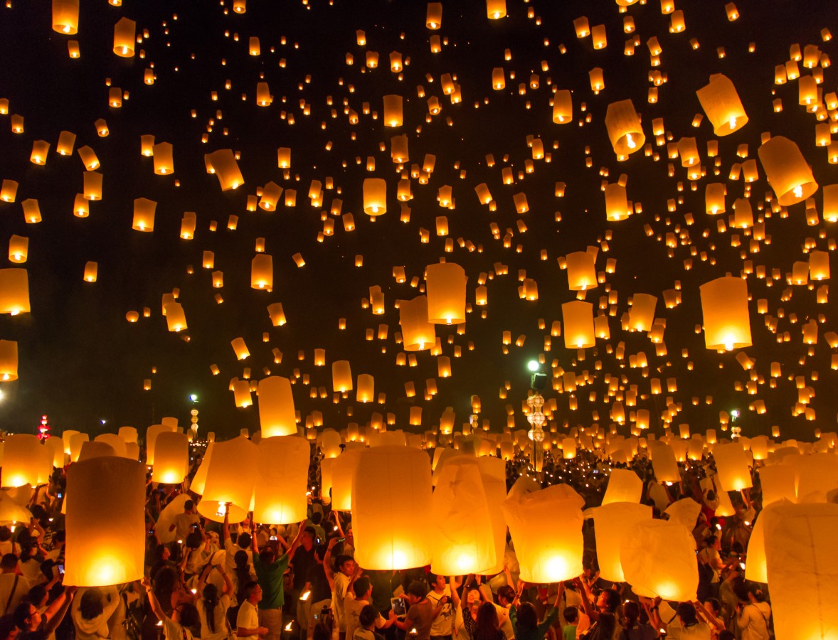 A group of people releasing lanterns