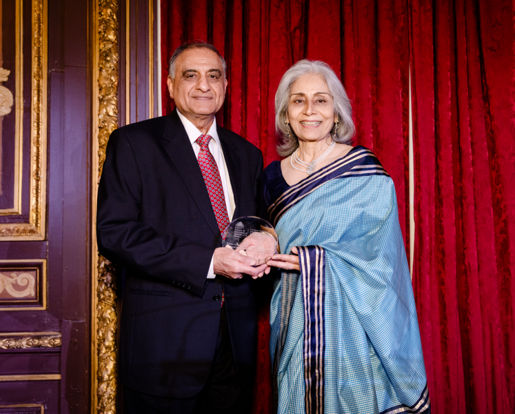 2026 MS Celebration Honorees Navin and Renu Gupta, MD on stage with award