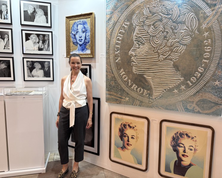Donor Lori Hall stands within the Marilyn Monroe exhibit at Grand Central Terminal
